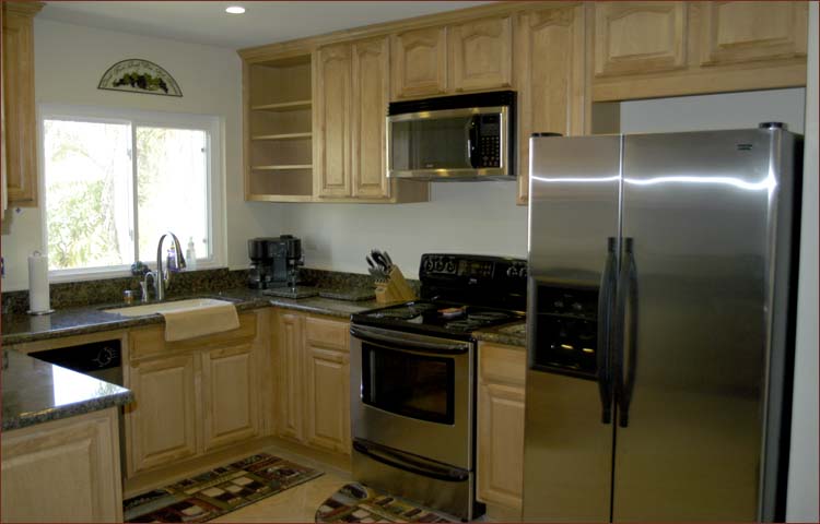 New stainless steel appliances in the fully equipped kitchen.